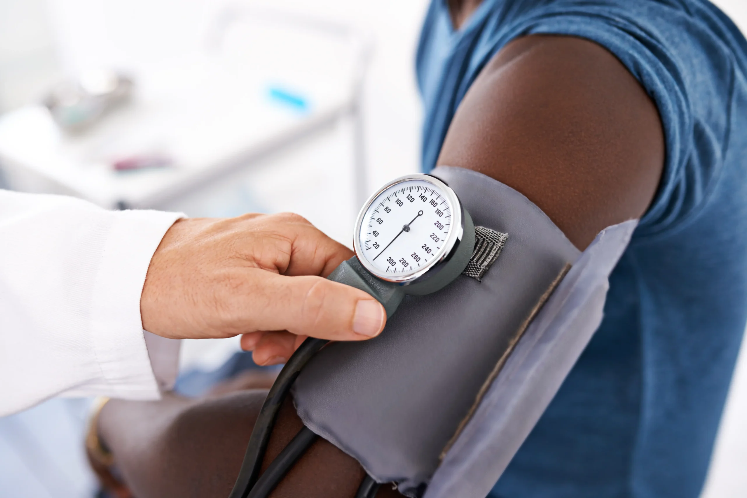 Patient getting their blood pressure checked by doctor